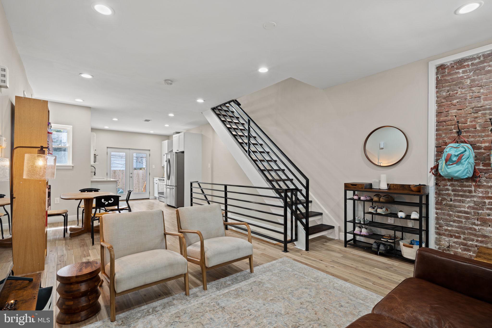 2934 Nicholas Street Philadelphia, PA 19121 - Photo 4 of 33 a living room with furniture a rug and white walls