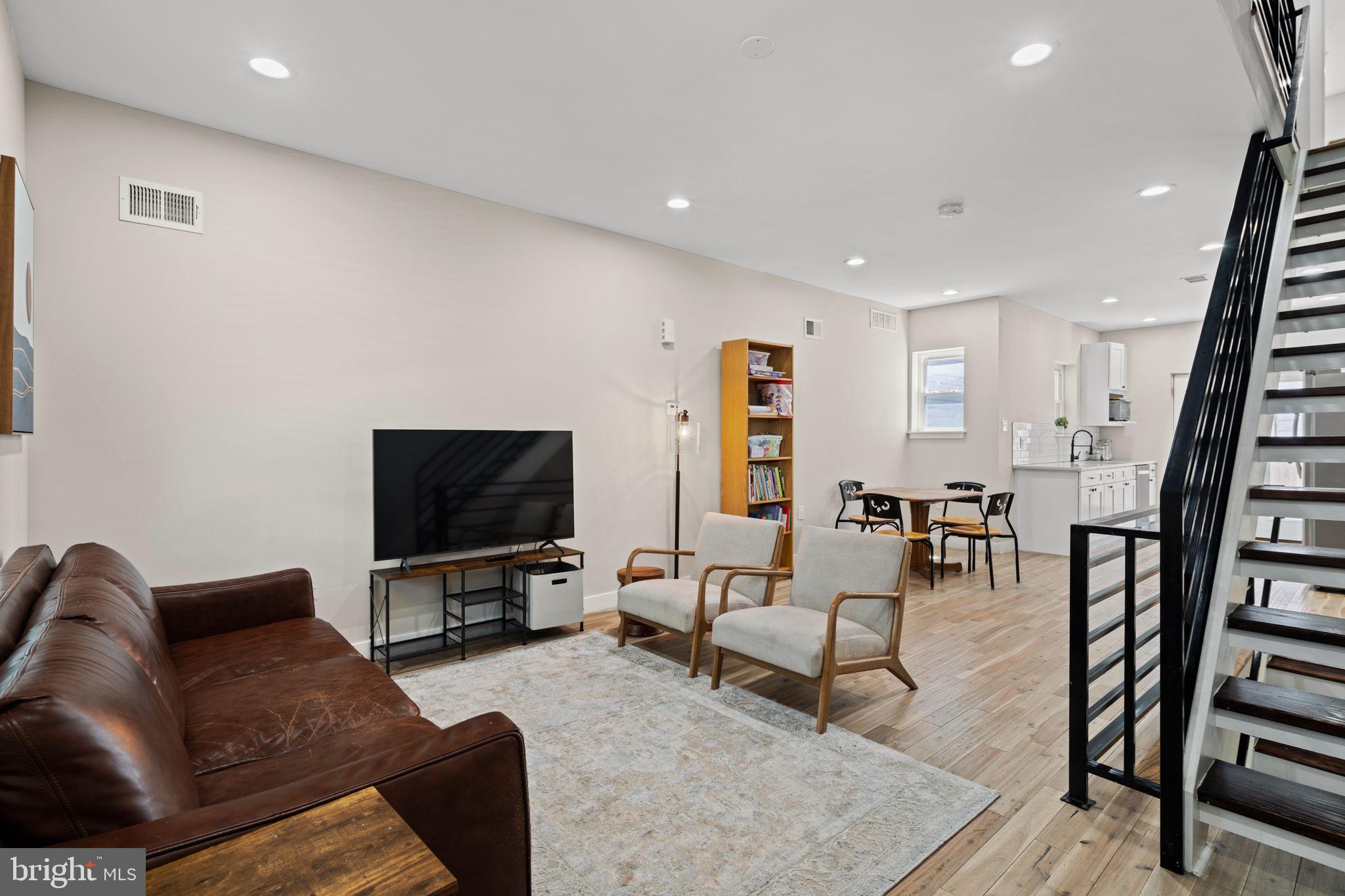 2934 Nicholas Street Philadelphia, PA 19121 - Photo 5 of 33 a living room with furniture and a flat screen tv