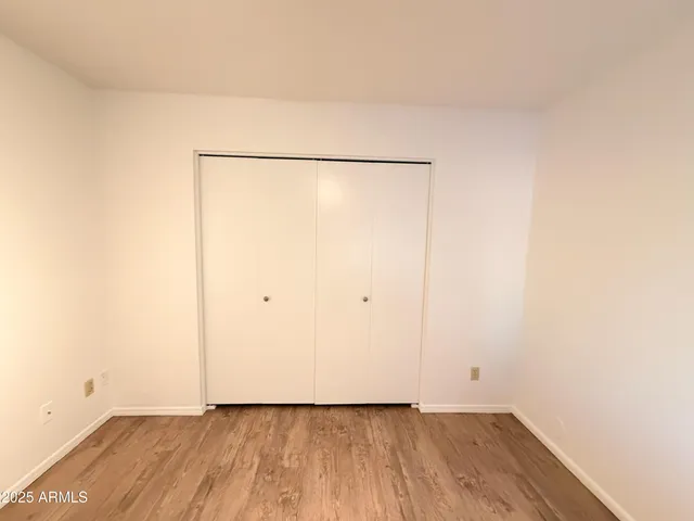 a view of a small space with wooden floor