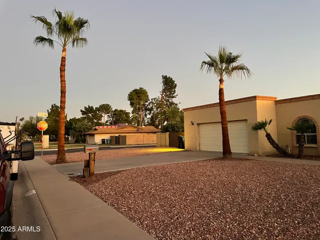 a swimming pool with a yard and outdoor seating