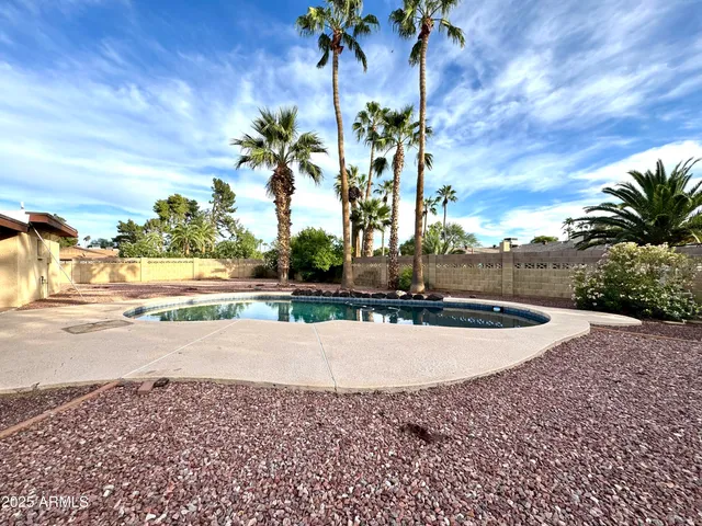 a view of a backyard of the house