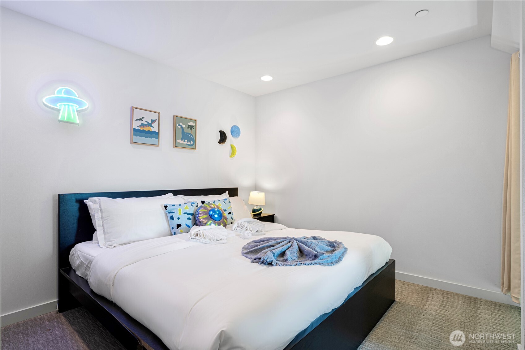 1546 Sturgus Avenue South Seattle, WA 98144 - Photo 16 of 23 a bedroom with a bed and a wall painting