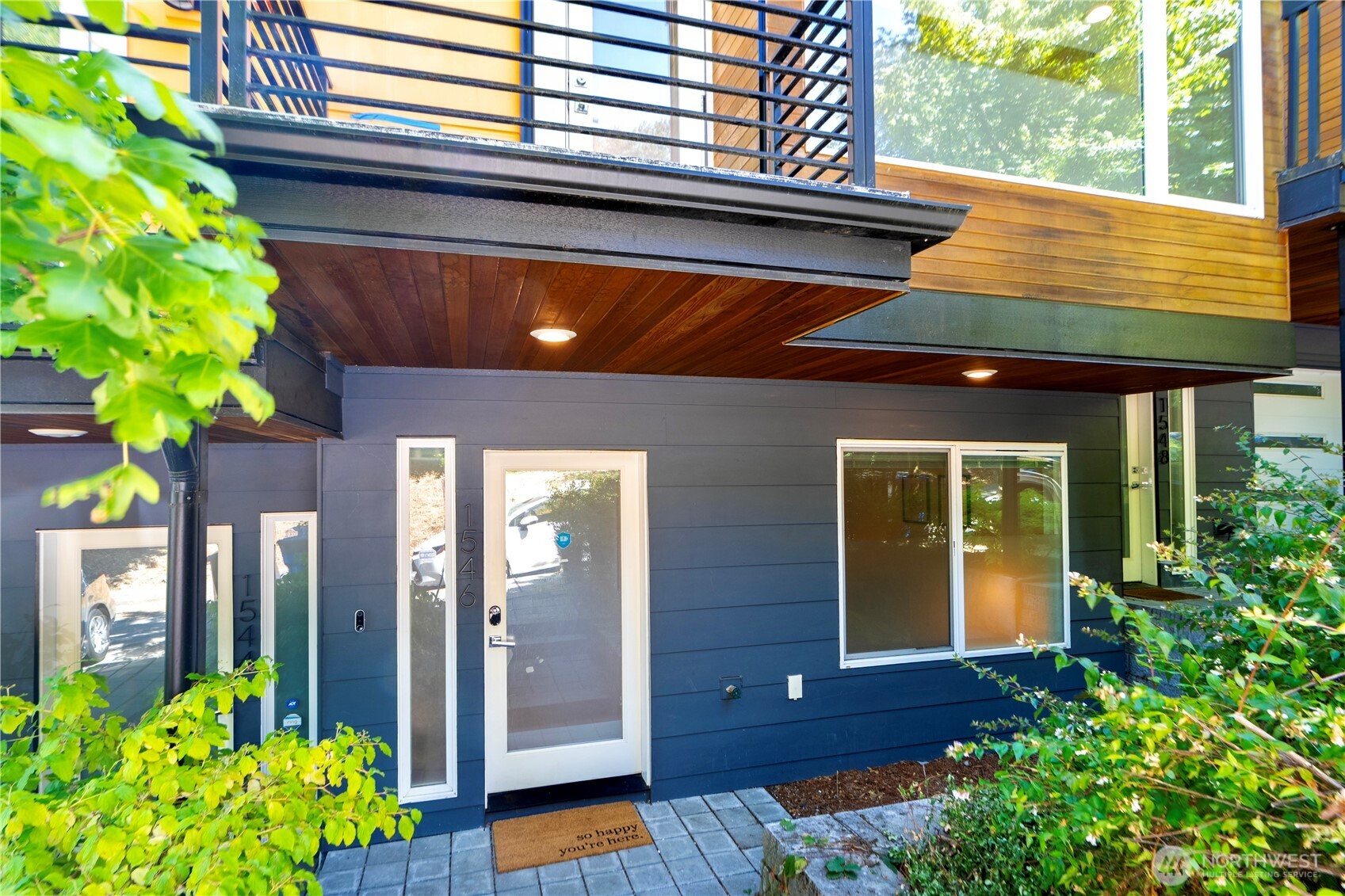 1546 Sturgus Avenue South Seattle, WA 98144 - Photo 2 of 23 a view of a house with potted plants and a table and chair
