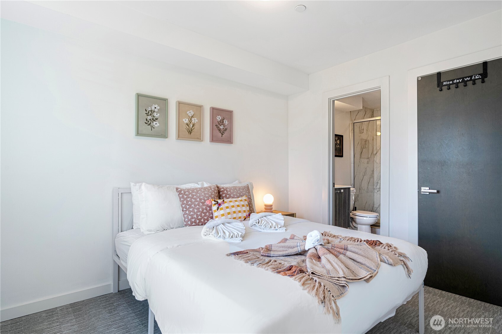 1546 Sturgus Avenue South Seattle, WA 98144 - Photo 9 of 23 a bedroom with a bed and a night stand