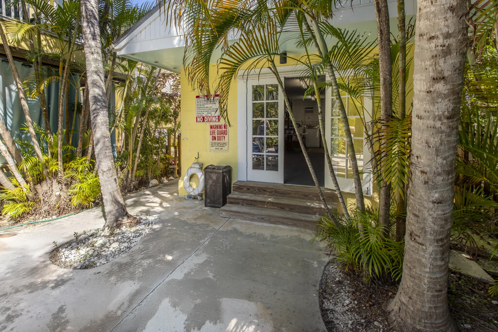 804 South Street, Unit 3 Key West, FL 33040 - Photo 20 of 22 a view of entrance gate of yellow house
