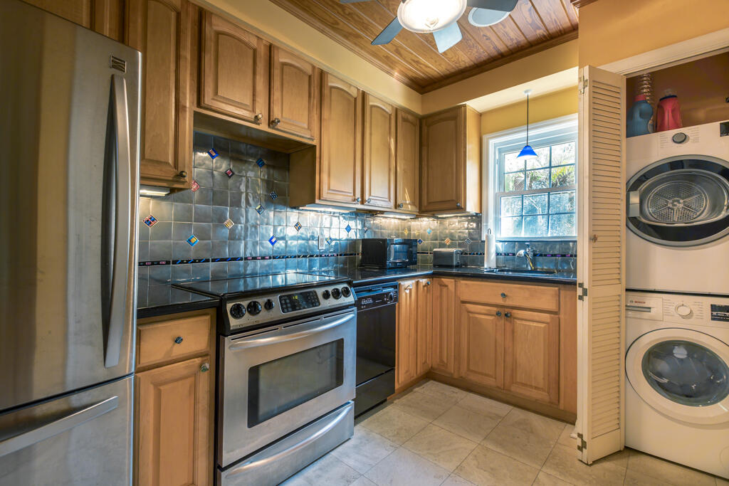 804 South Street, Unit 3 Key West, FL 33040 - Photo 6 of 22 a kitchen with granite countertop a stove top oven sink and cabinets
