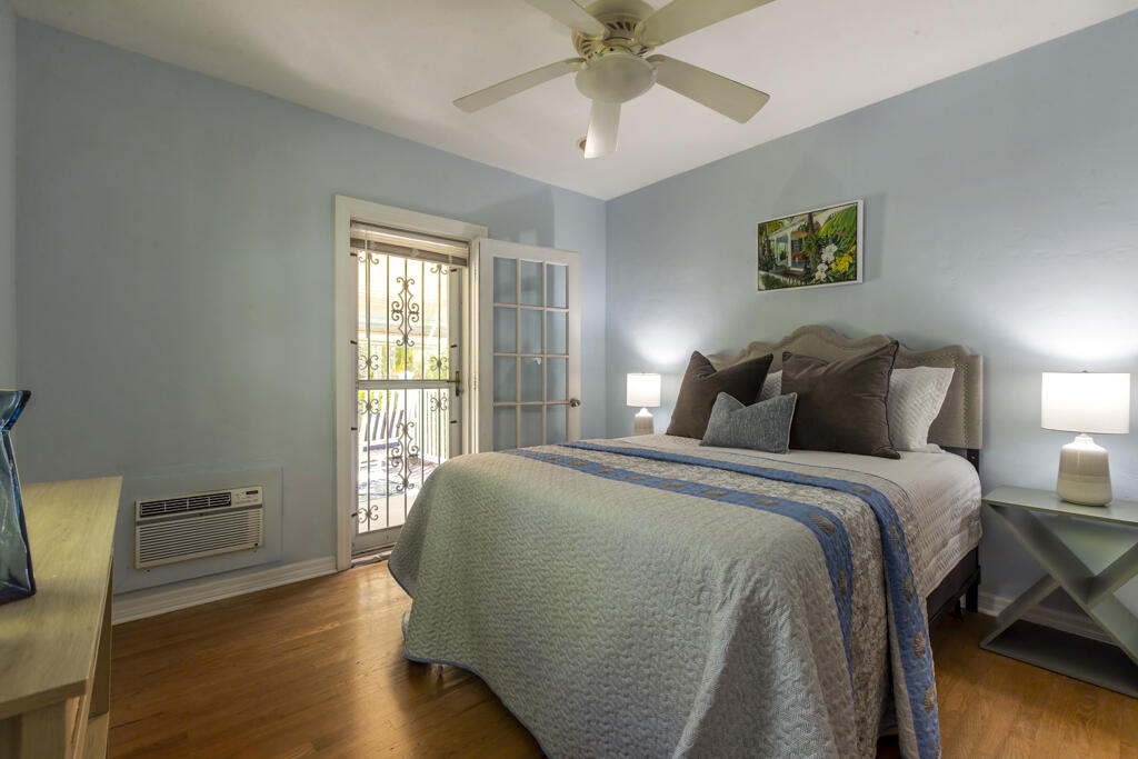 804 South Street, Unit 3 Key West, FL 33040 - Photo 7 of 22 a spacious bedroom with a bed and a window