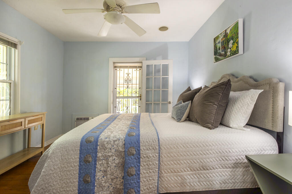 804 South Street, Unit 3 Key West, FL 33040 - Photo 9 of 22 a bedroom with a bed and a window