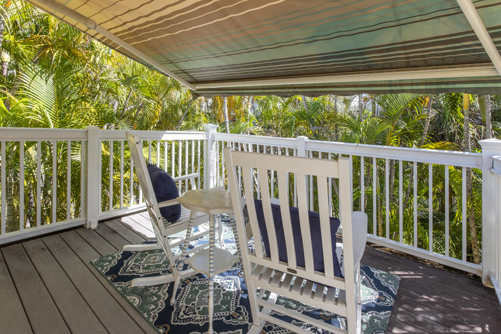 804 South Street, Unit 3 Key West, FL 33040 - Photo 10 of 22 a view of balcony with wooden floor and outdoor seating