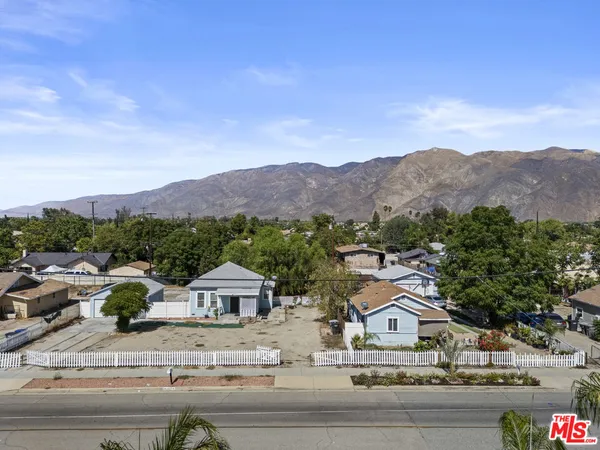 an aerial view of residential houses and street