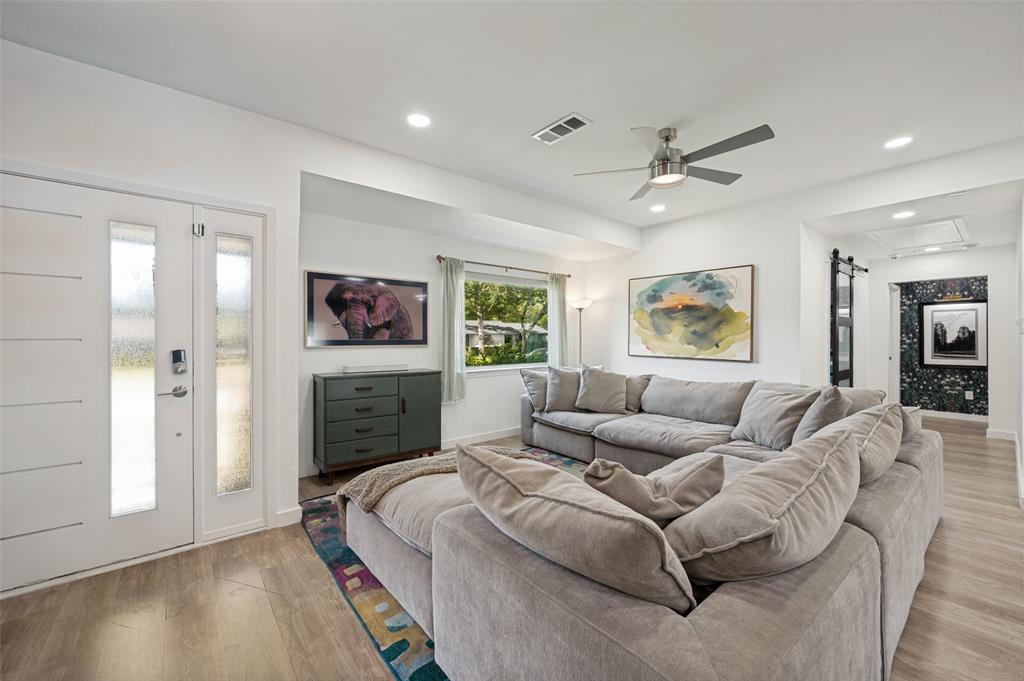 3619 Merrell Road Dallas, TX 75229 - Photo 4 of 26 Open-concept living space featuring wood-finish flooring, recessed lighting, and a contemporary ceiling fan