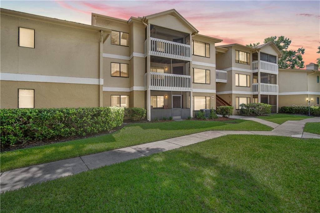 1550 South Belcher Road, Unit 124 Clearwater, FL 33764 - Photo 1 of 1 a view of a building next to a big yard