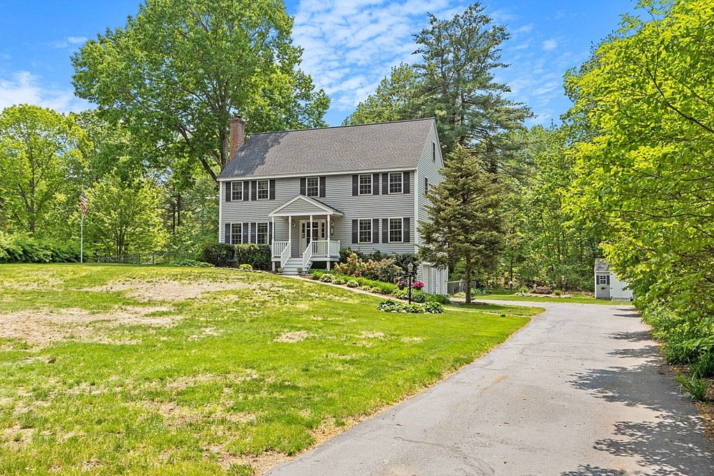 54 Little Turnpike Road Shirley, MA 01464 - Photo 1 of 39 a front view of a house with swimming pool having outdoor seating