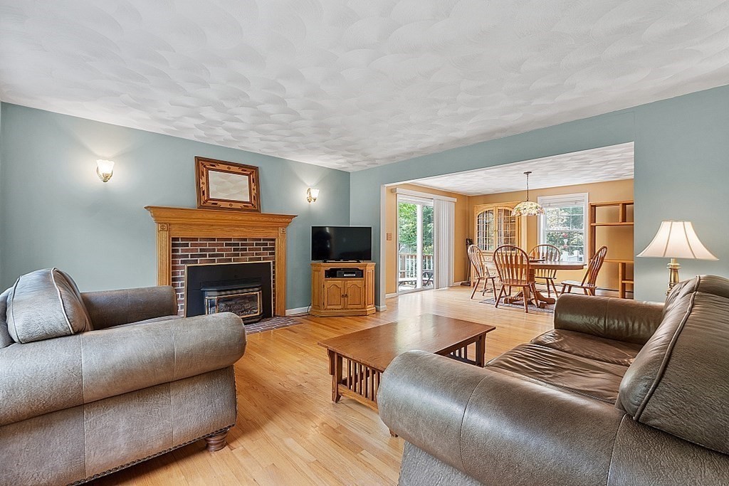 54 Little Turnpike Road Shirley, MA 01464 - Photo 16 of 39 a living room with furniture and a fireplace