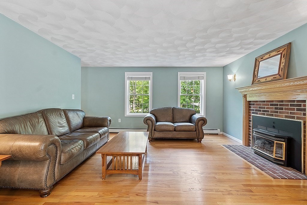 54 Little Turnpike Road Shirley, MA 01464 - Photo 17 of 39 a living room with furniture and a fireplace