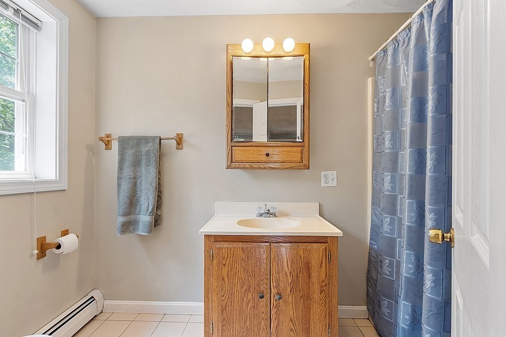 54 Little Turnpike Road Shirley, MA 01464 - Photo 24 of 39 a bathroom with a sink and mirror