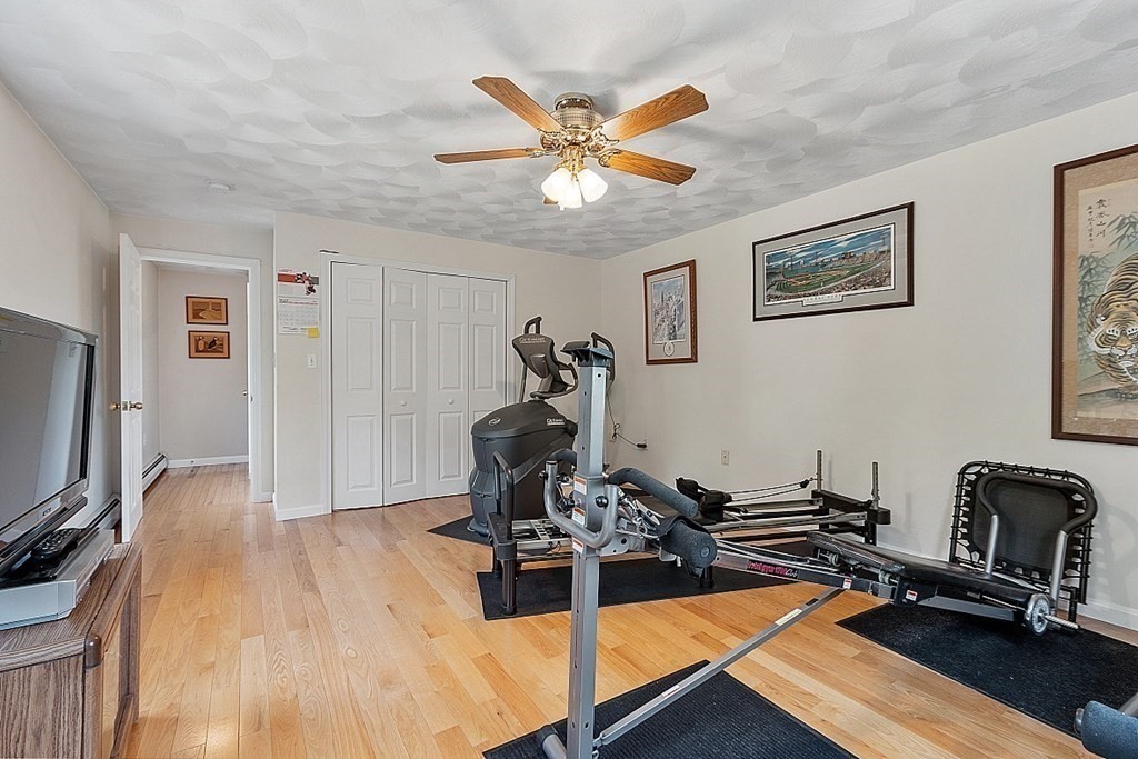 54 Little Turnpike Road Shirley, MA 01464 - Photo 25 of 39 a view of a livingroom with furniture and a ceiling fan