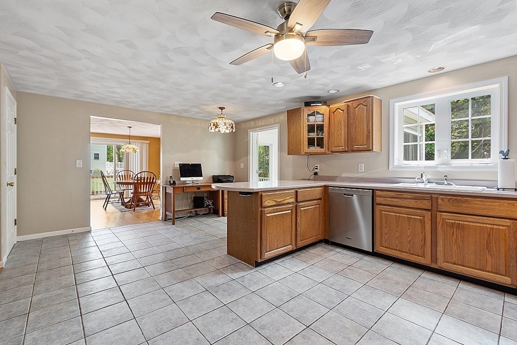 54 Little Turnpike Road Shirley, MA 01464 - Photo 3 of 39 a kitchen with stainless steel appliances granite countertop a sink cabinets and window