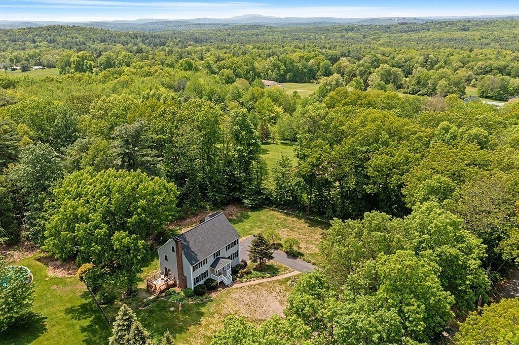 54 Little Turnpike Road Shirley, MA 01464 - Photo 33 of 39 a view of a forest with a street