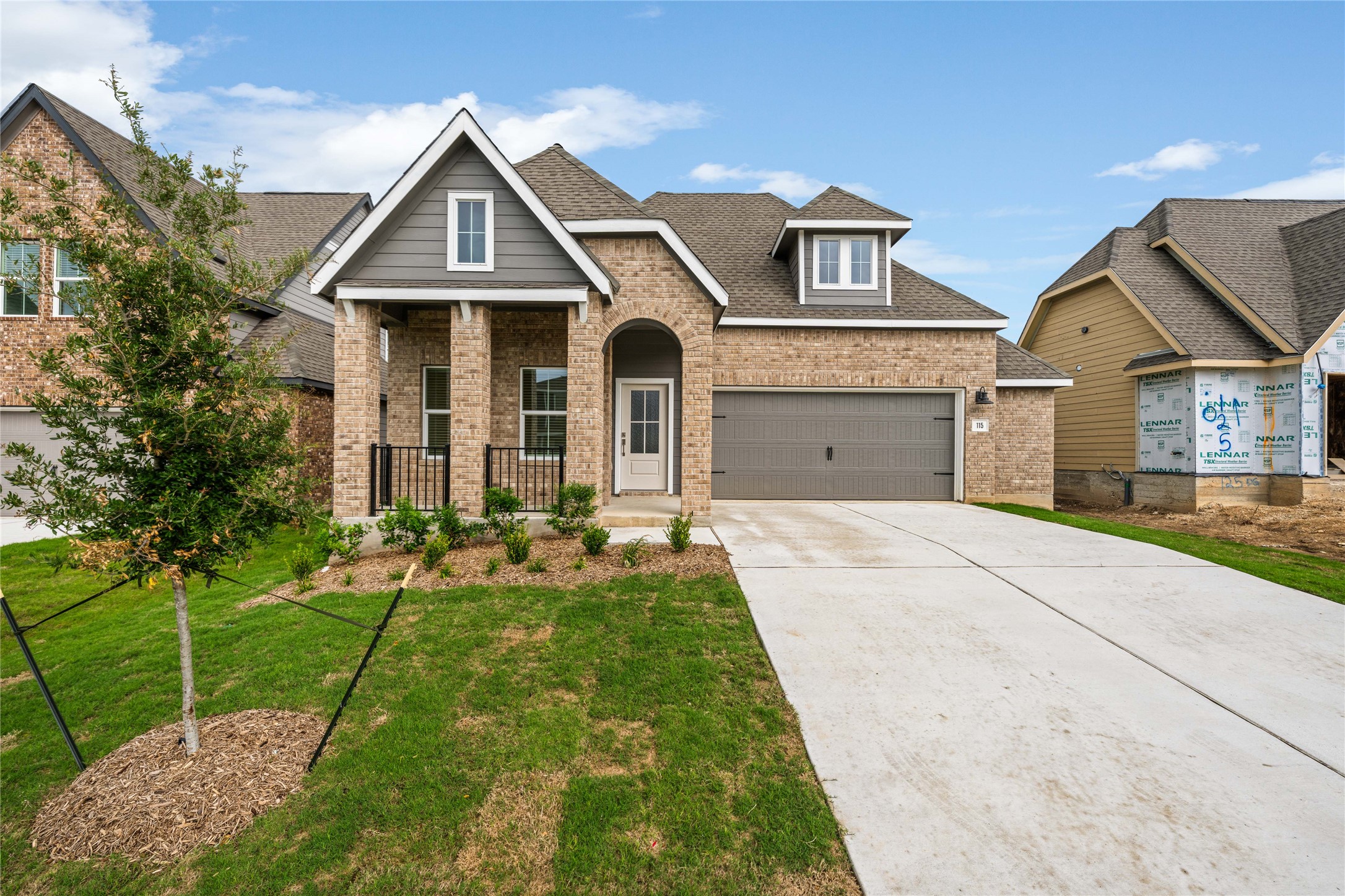 115 Parsons Kyle, TX 78640 - Photo 1 of 18 A welcoming facade with a brick exterior and neatly manicured landscaping offers inviting curb appeal.