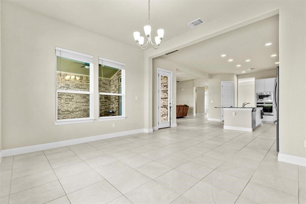 111 Tabago Court Austin, TX 78737 - Photo 11 of 22 a view of an empty room with a kitchen