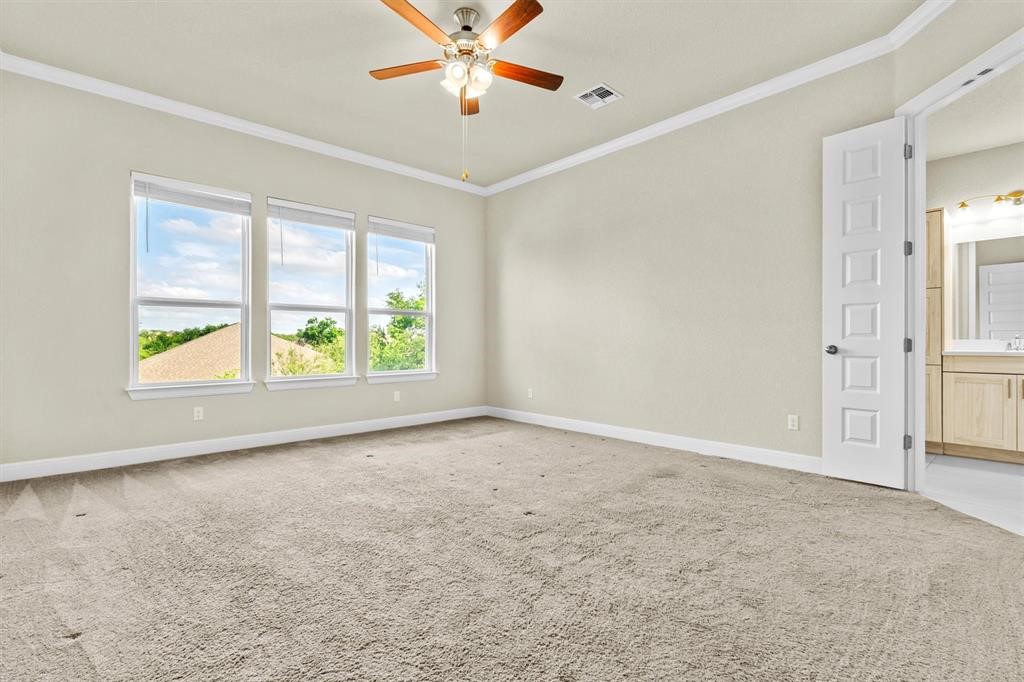 111 Tabago Court Austin, TX 78737 - Photo 12 of 22 an empty room with fan and windows