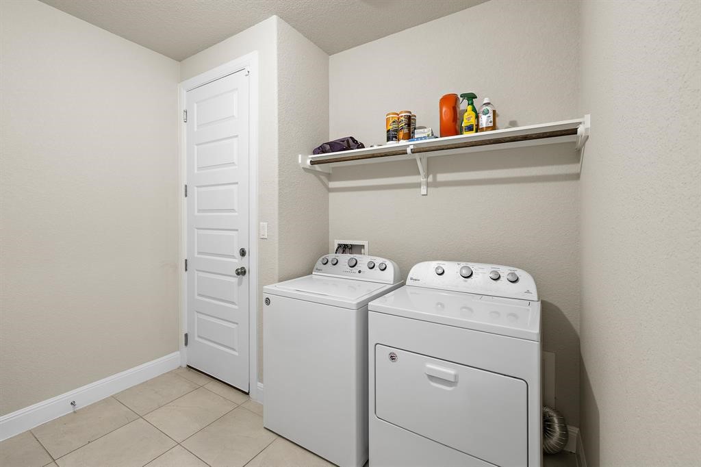 111 Tabago Court Austin, TX 78737 - Photo 18 of 22 a utility room with dryer and washer