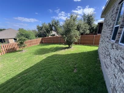 111 Tabago Court Austin, TX 78737 - Photo 22 of 22 a view of a backyard with a garden