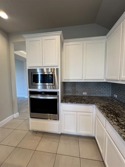 111 Tabago Court Austin, TX 78737 - Photo 7 of 22 a kitchen with granite countertop white cabinets and appliances