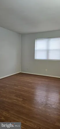 a view of room with wooden floor