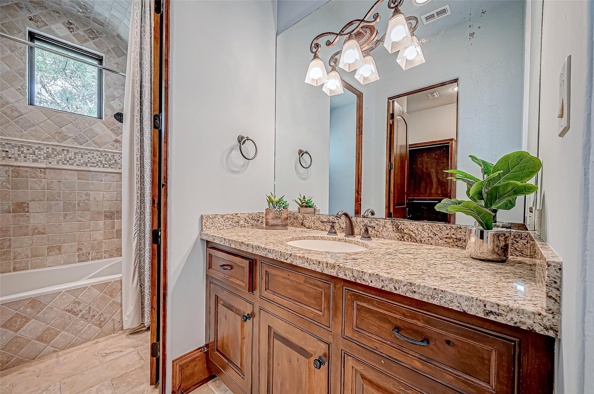 3 Congressional Circle Spring, TX 77389 - Photo 37 of 48 a bathroom with a granite countertop sink a large mirror and a shower