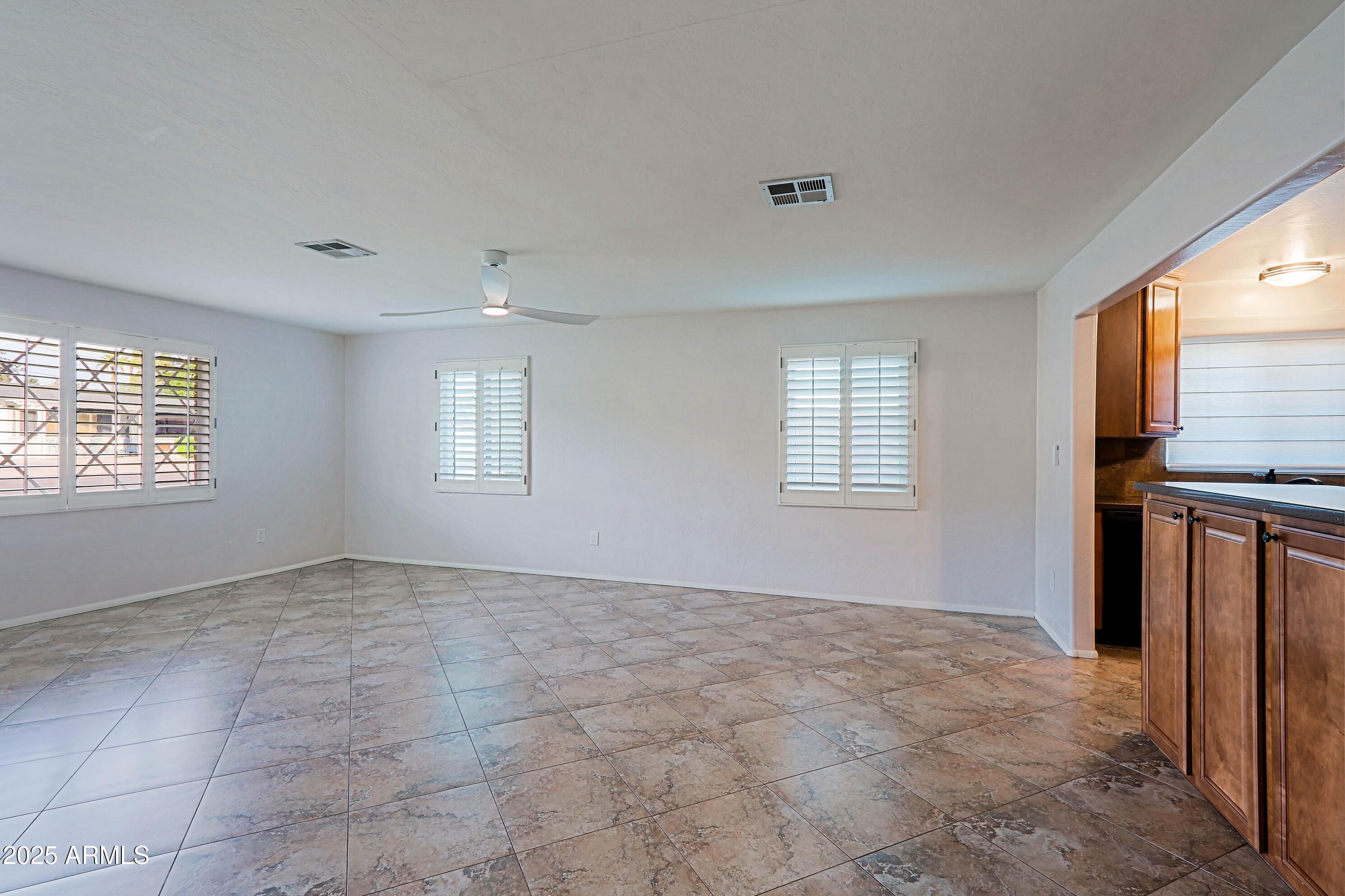 5509 East Cheery Lynn Road, Unit 2E Phoenix, AZ 85018 - Photo 7 of 25 a view of an empty room with a window