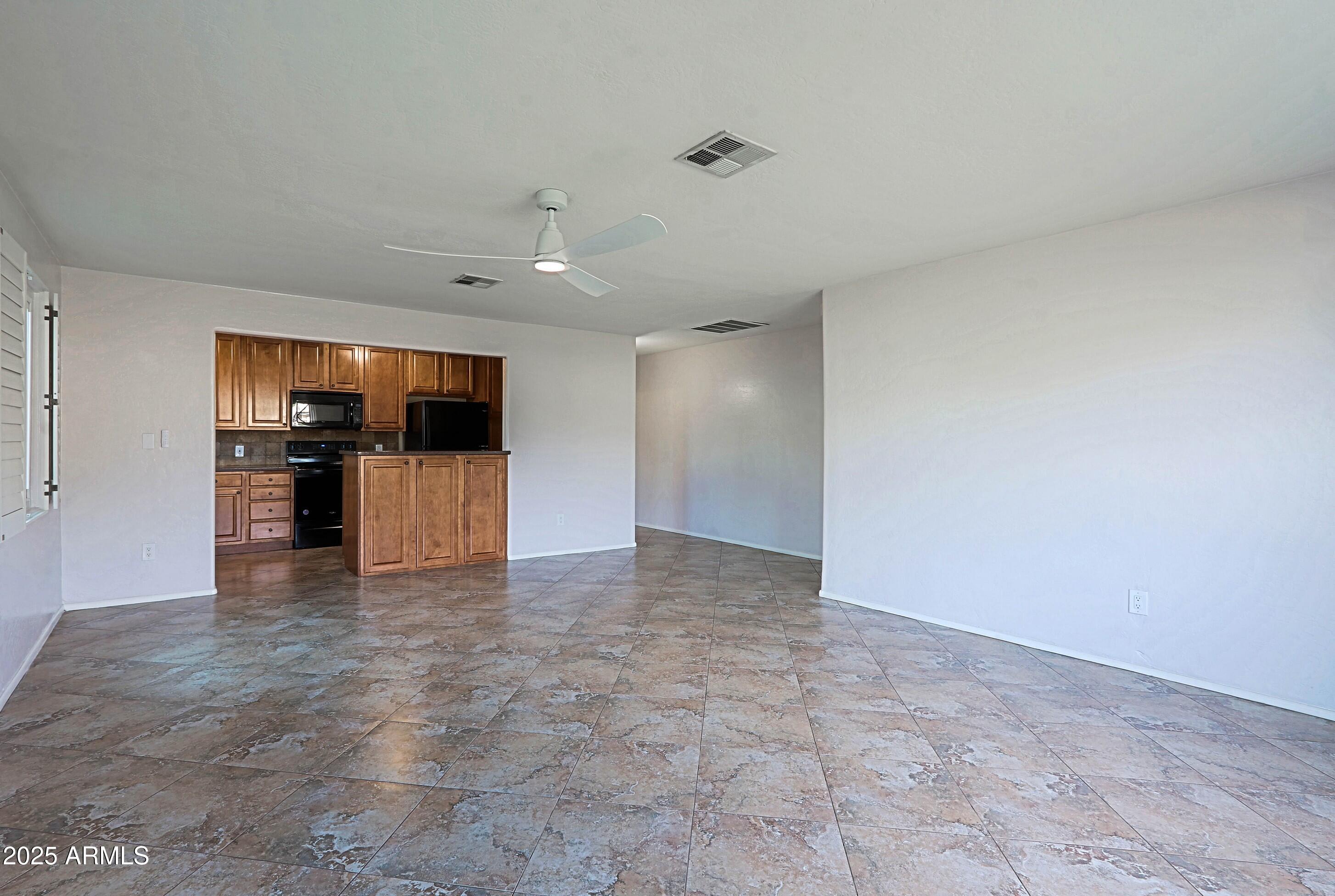 5509 East Cheery Lynn Road, Unit 2E Phoenix, AZ 85018 - Photo 9 of 25 a view of a kitchen with a sink
