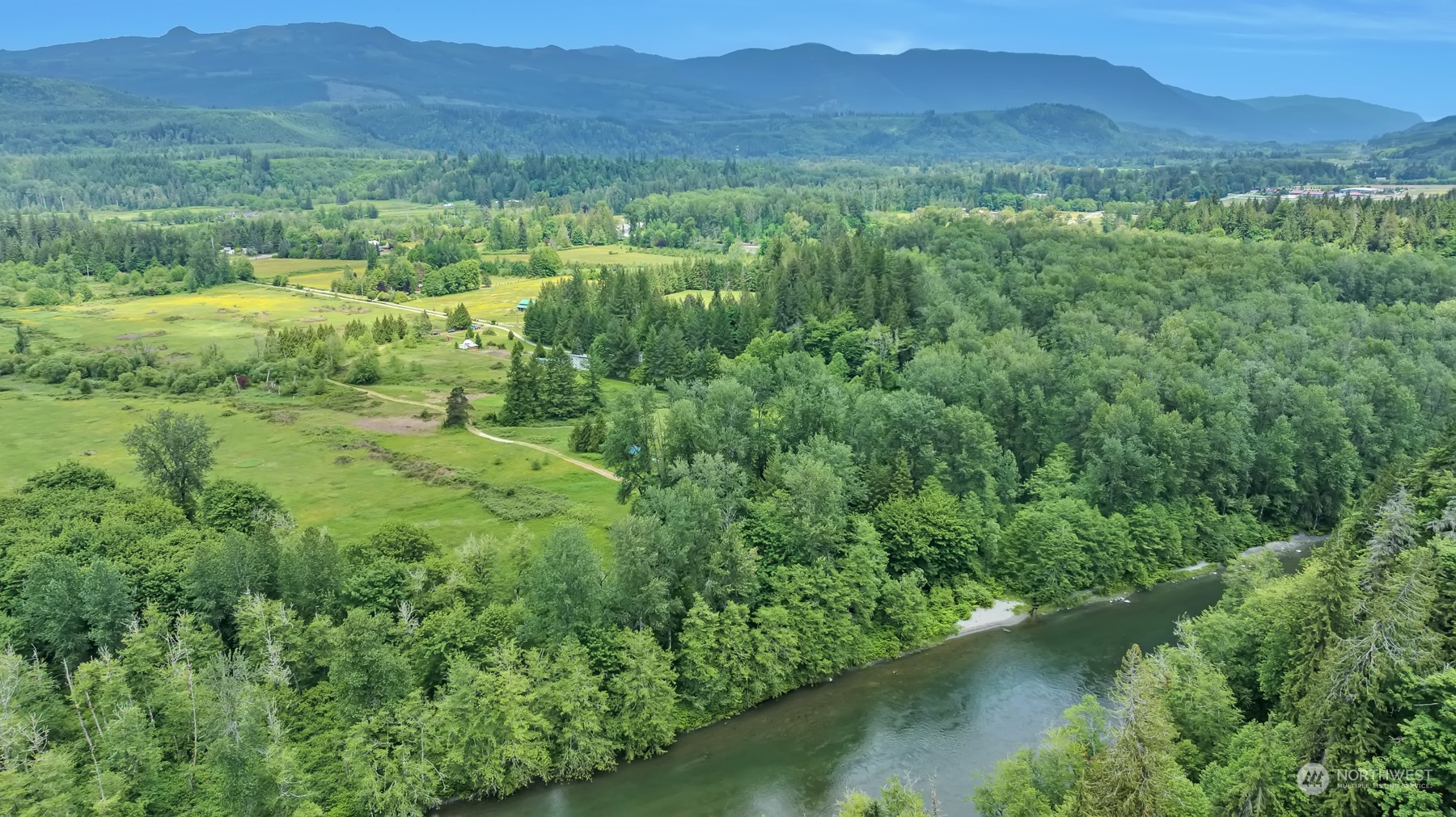 202 State Rte 20 Colville, WA 99114 - Photo 5 of 10 a view of a lush green hillside and houses