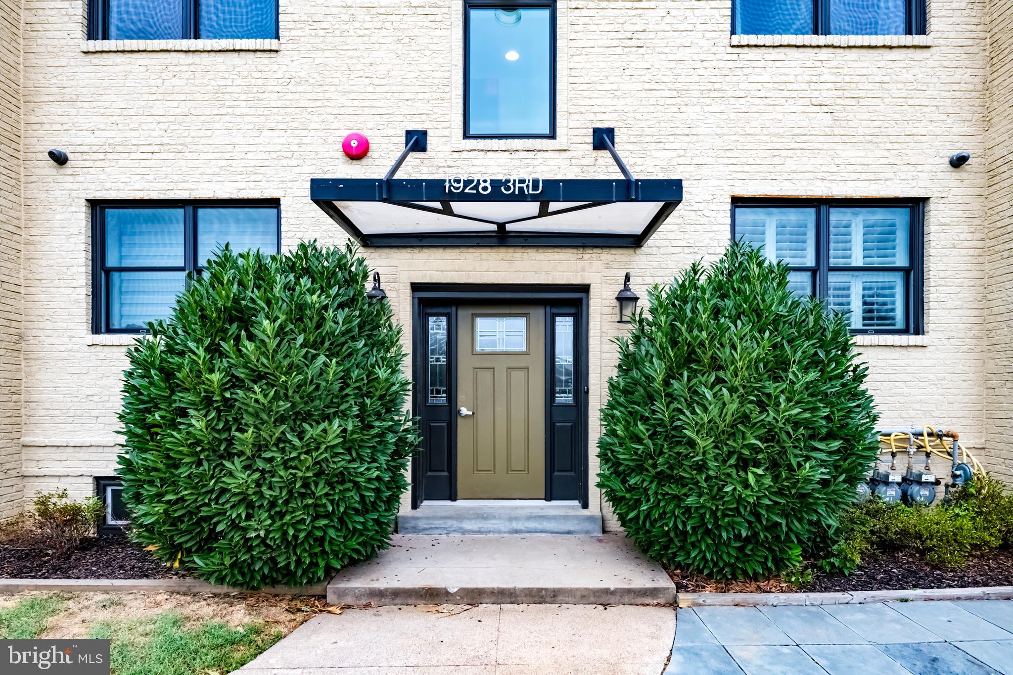 1928 3rd Street Northeast, Unit 2 Washington, DC 20002 - Photo 2 of 20 a front view of a house with garden