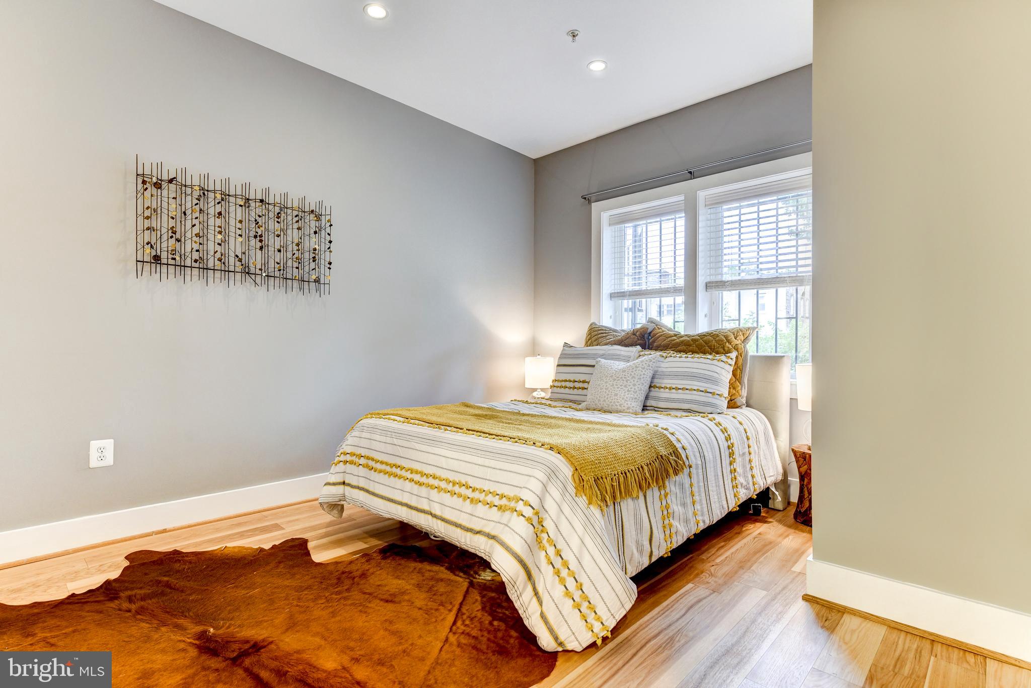 1928 3rd Street Northeast, Unit 2 Washington, DC 20002 - Photo 14 of 20 a bedroom with bed and a window