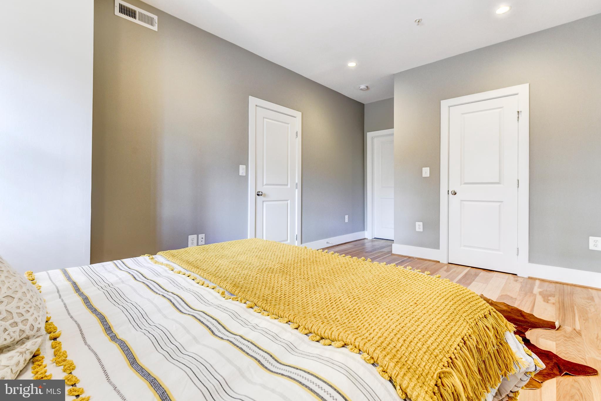 1928 3rd Street Northeast, Unit 2 Washington, DC 20002 - Photo 15 of 20 a bedroom with a bed and a window