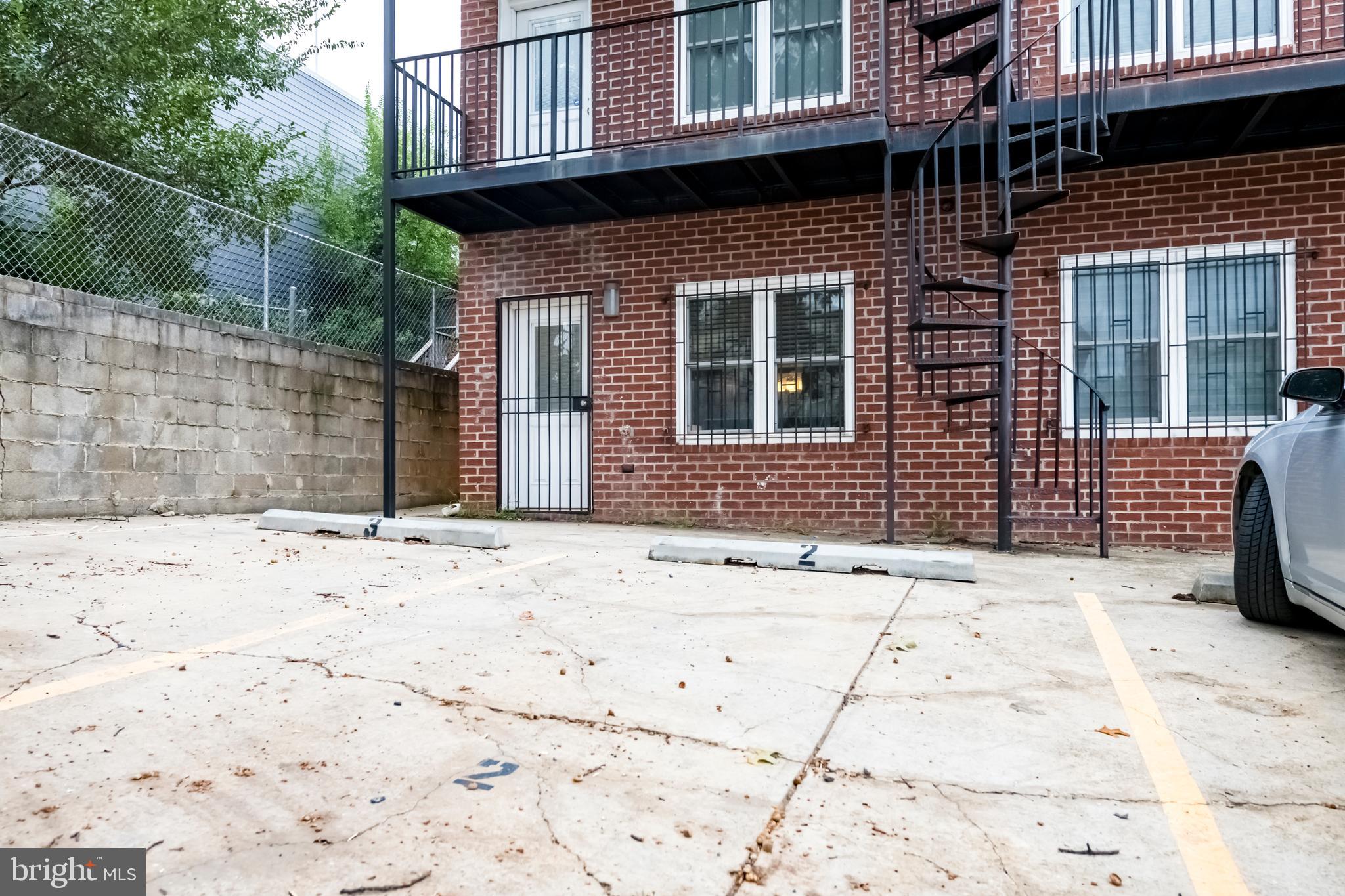1928 3rd Street Northeast, Unit 2 Washington, DC 20002 - Photo 19 of 20 a view of a brick house with many windows