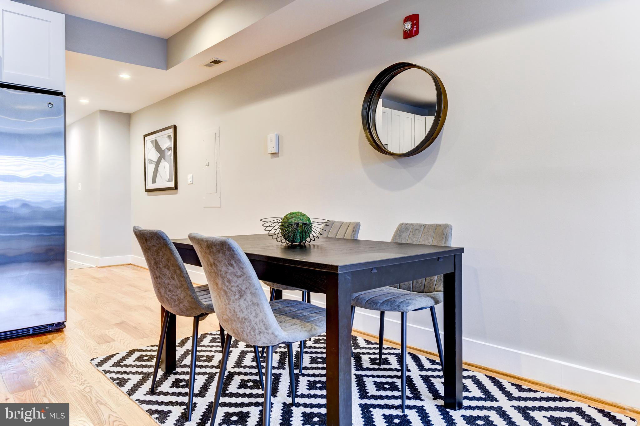 1928 3rd Street Northeast, Unit 2 Washington, DC 20002 - Photo 7 of 20 a view of a dining room with furniture and wooden floor