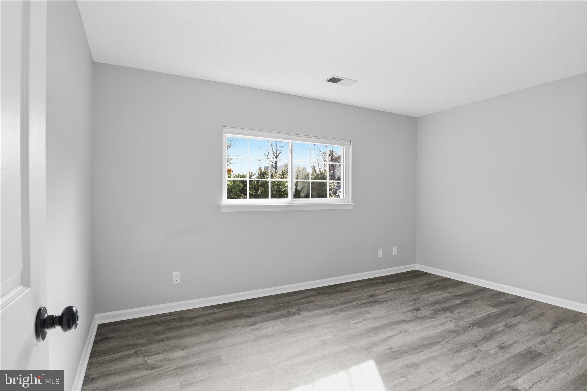 12002 Golf Ridge Court Fairfax, VA 22033 - Photo 17 of 43 a view of a room with wooden floor and window