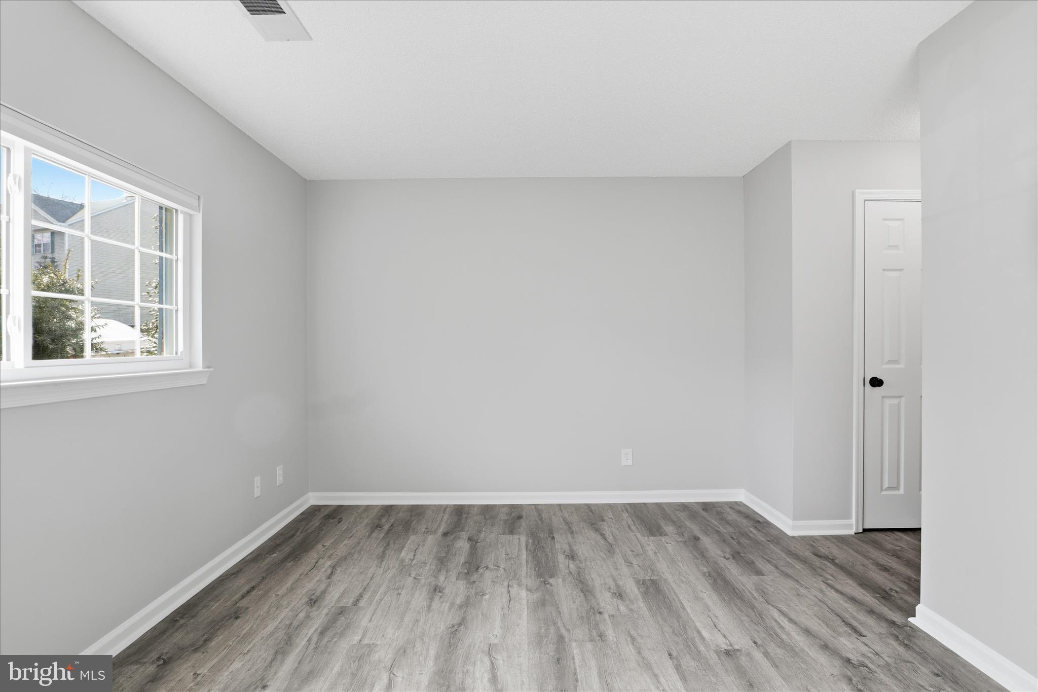 12002 Golf Ridge Court Fairfax, VA 22033 - Photo 19 of 43 a view of a room that has wooden floor and windows in it