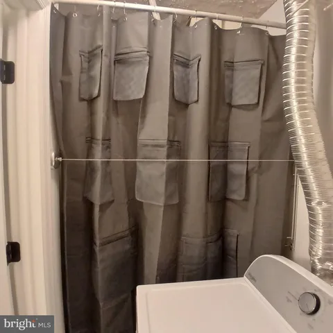 a bathroom with a sink and a shower