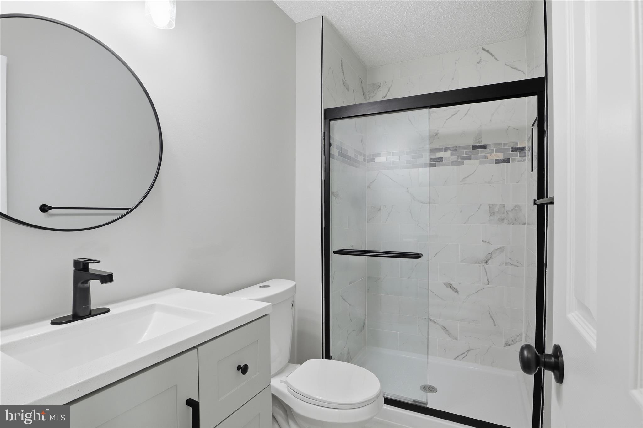 12002 Golf Ridge Court Fairfax, VA 22033 - Photo 25 of 43 a bathroom with a sink vanity mirror and toilet