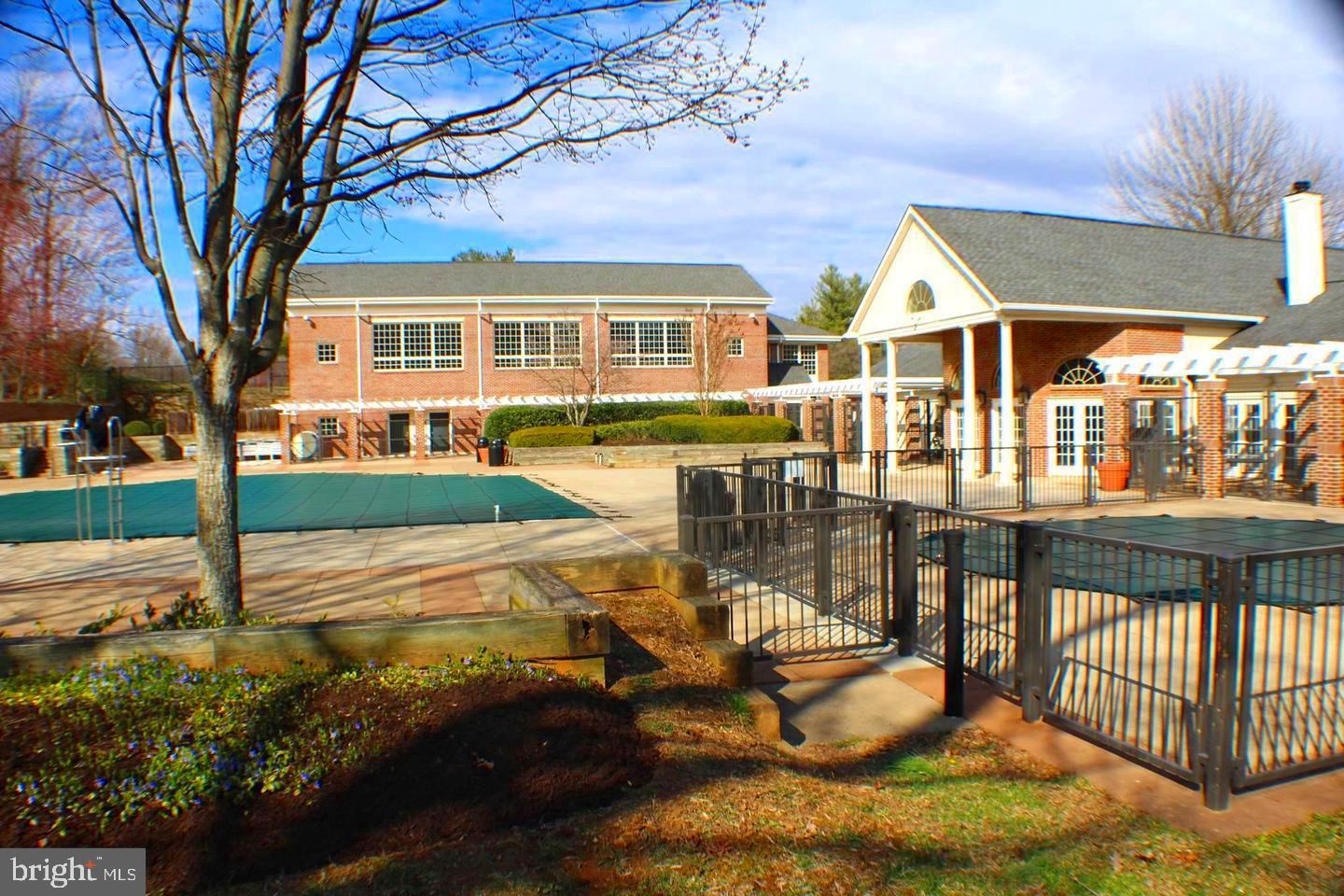 12002 Golf Ridge Court Fairfax, VA 22033 - Photo 36 of 43 a front view of a house with a yard