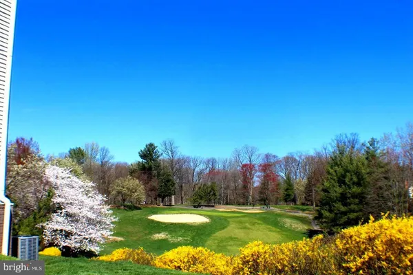 a sign that is sitting in front of flowers