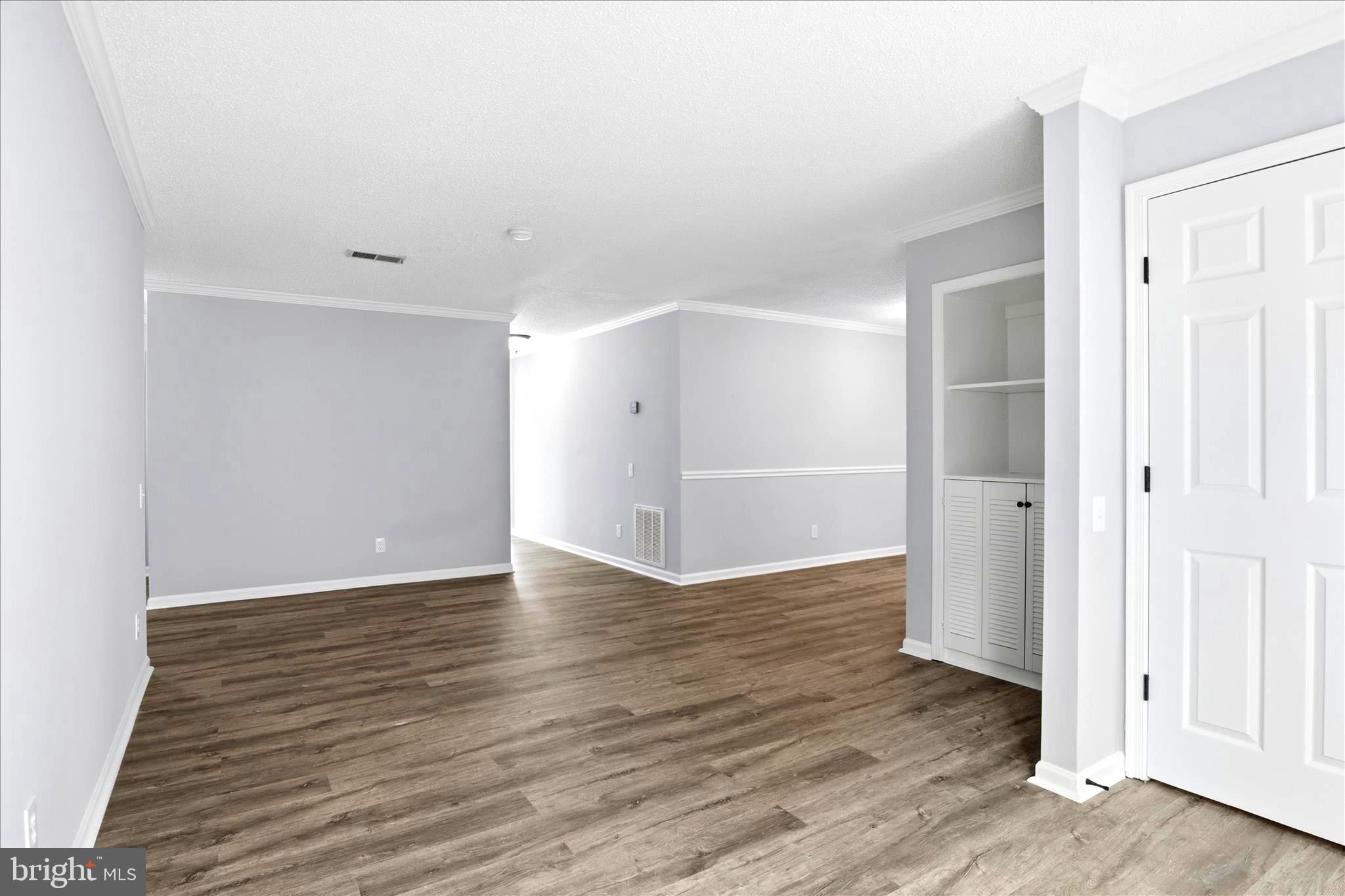 12002 Golf Ridge Court Fairfax, VA 22033 - Photo 9 of 43 a view of an empty room with wooden floor