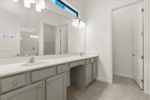a kitchen with stainless steel appliances a refrigerator stove microwave and sink