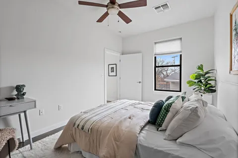 a bedroom with a bed and a window