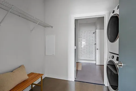 a view of a storage and utility room with washer and dryer