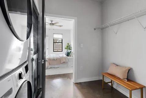 a hallway with furniture and wooden floor
